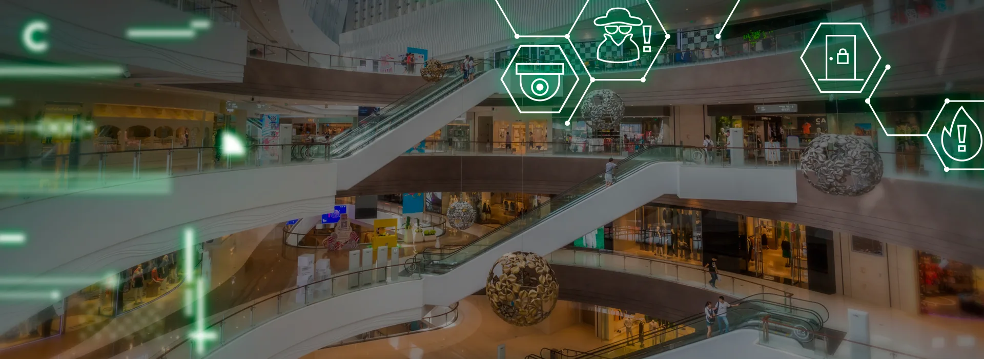 Centro comercial con hexágonos verdes mostrando seguridad electrónica, cámaras CCTV y prevención de incendios.